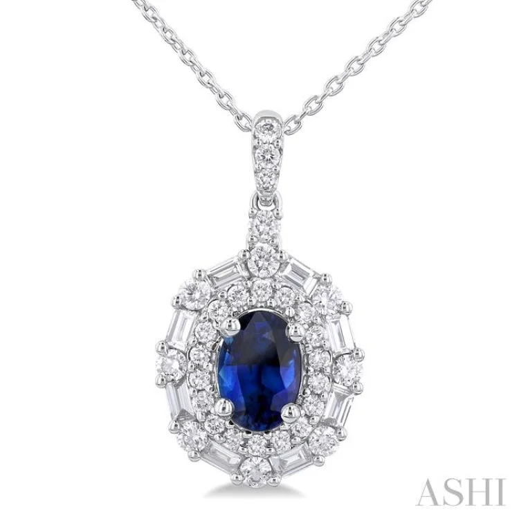 7X5MM Oval Cut Sapphire and 5/8 ctw Baguette & Round Cut Diamond Halo Precious Pendant With Chain in 14K White Gold