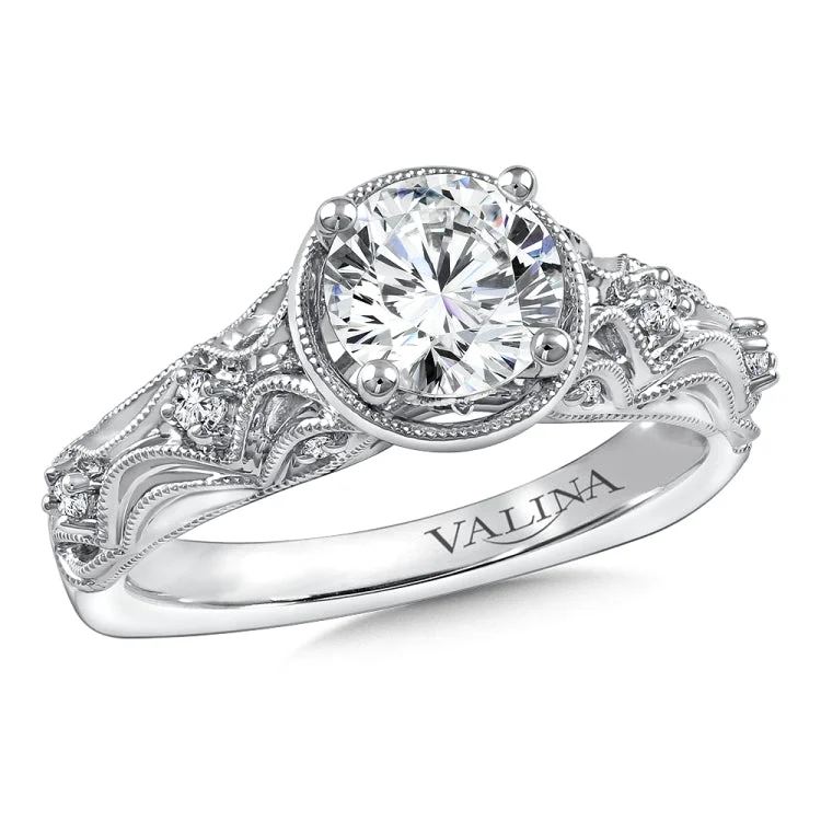 Diamond engagement ring mounting with milgrain detailing and side stones set in 14k white gold.