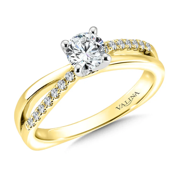 Split shank style diamond engagement ring set in 14k gold.