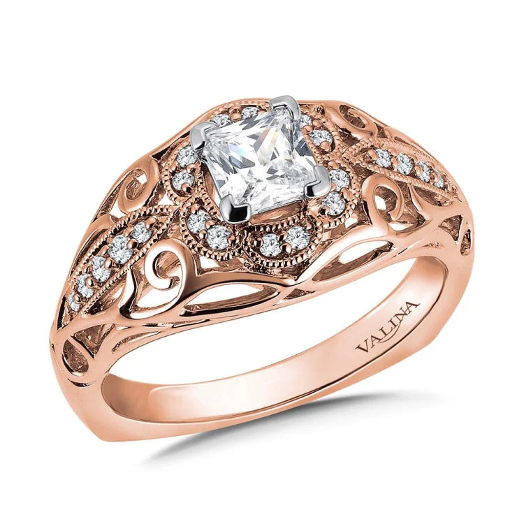 Diamond engagement ring mounting with milgrain detailing and side stones set in 14k rose gold.