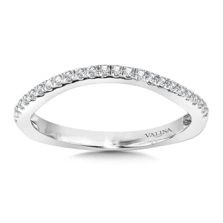 This true fit matching diamond wedding band gracefully curves as a beautiful reminder of that special day for years to come.