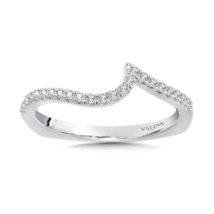 This true fit diamond wedding band curves perfectly to fit its spiral engagement ring like a glove.