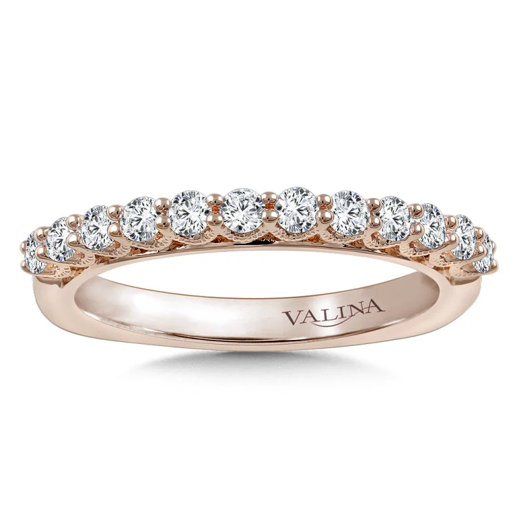 Diamond stackable wedding band with intricate milgrain detailing in 14k rose gold.